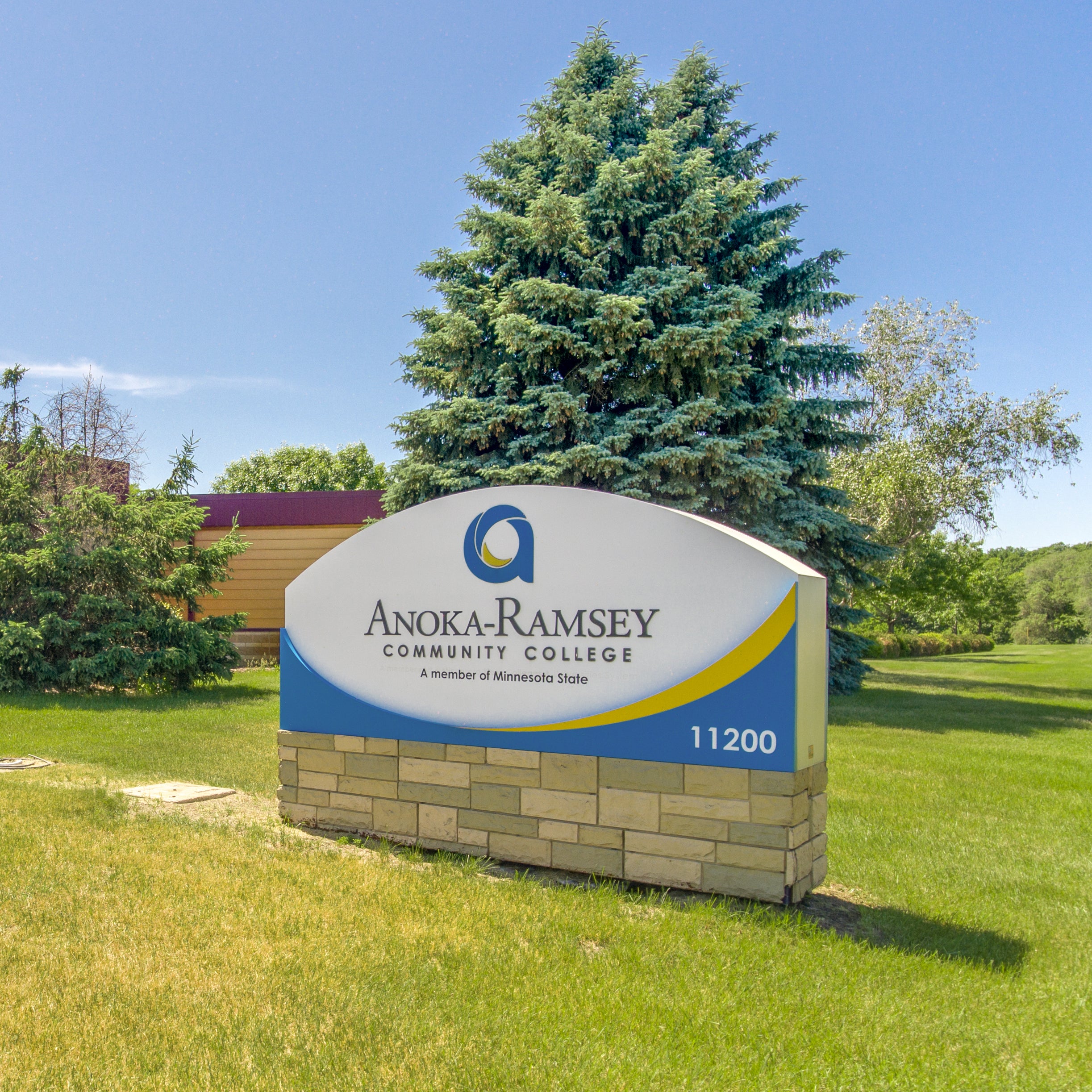 Monument sign at Coon Rapids Campus on corner