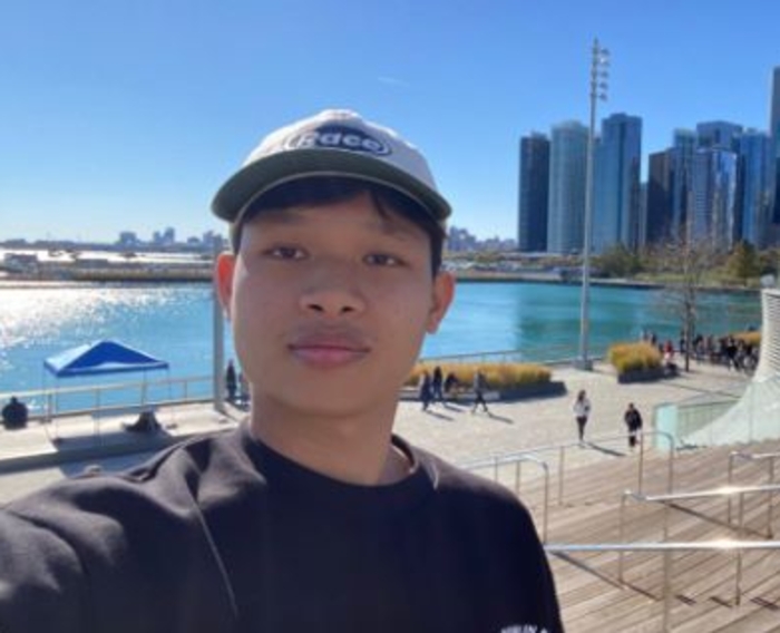Student Scholarship Recipient Virakda Bun Headshot with Skyline in background