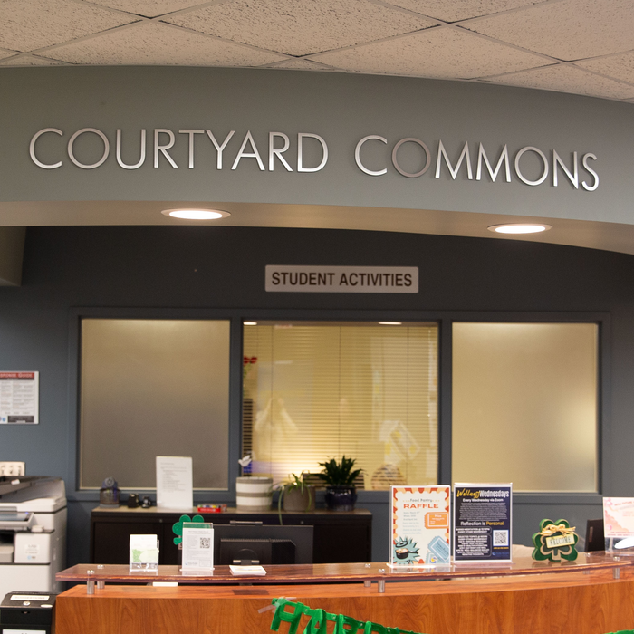 A desk with a sign titled "Student Activities" above. 