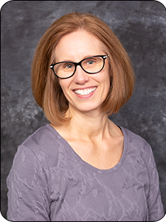 Photo of individual wearing gray shirt