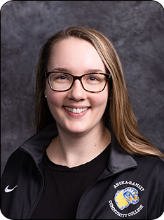 Individual wearing Anoka-Ramsey branded jacket