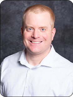 Individual wearing white collared shirt